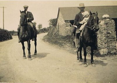 Eileen Wotton/Putt as a child with Uncle Jim Bowhay on the horse, and Arhtur Elliott, Florence Elliott/Wotton's younger brother, outside High House Farm