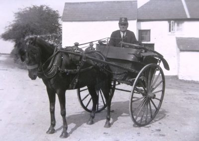 Postie Jim postman in 1920s top of Providence Hill and outside Fuscia Cottage (providence Cottage now)