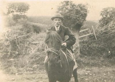 Postcard Jim Hannaford, the pig killer, with cider cask on pony