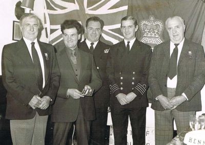 Coastguards, left to right: Bill Blank, Michael Partridge, Jack Appleton- station officer, not known, Jack Rendle. 1970s