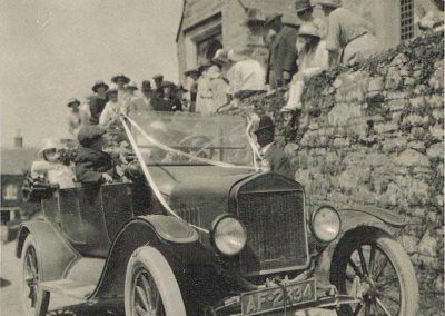 Jack Partridge driving the left-hand drive model T Ford circa 1931 at wedding at St Sylvester's Church Chivelstone