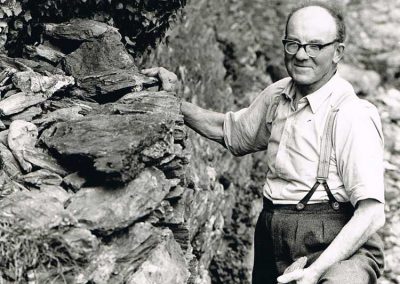 John Francis Tucker building a dry stone wall at Sharpers House about 1972 (born 14 March 1912)