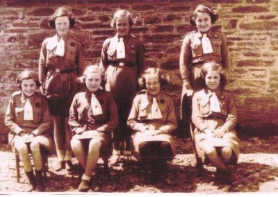 Girl Guides: Back row from left: Patsy Putt, Nancy Login, Rita Rundle; Front Row: Elsie Login, Unknown, Barbara Partridge, Queenie Weymouth, 1930s