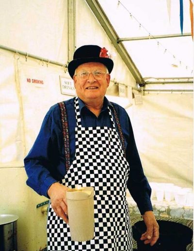 Steve Mitchelmore in bowler hat making tea, Prawle Fair 2002