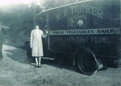 W E Tucker van with the label Town Farm East Prawle, Freda Caudell standing by (Roger Tucker's godmother)